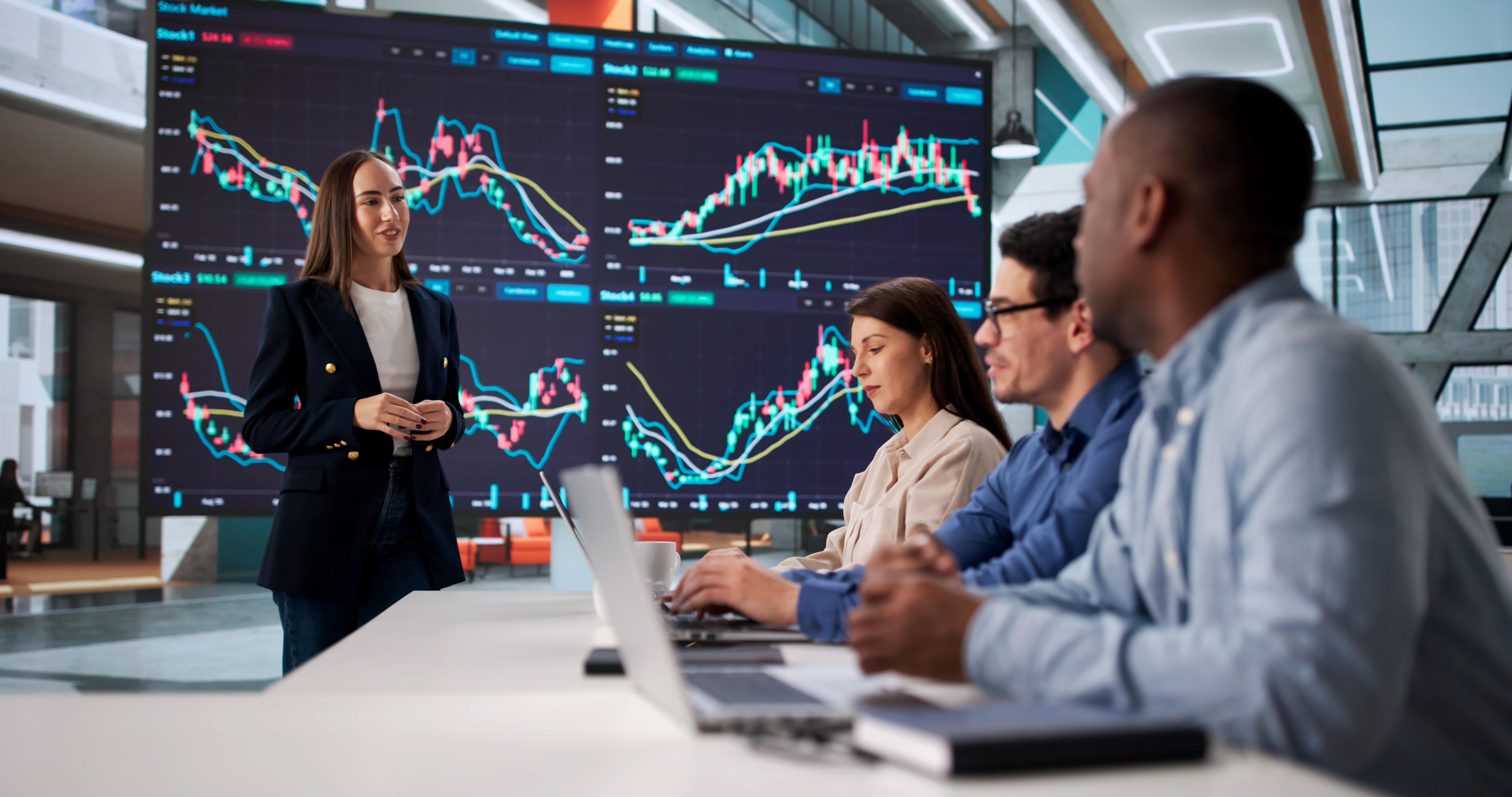 Multiracial Team In Meeting Learning Stock Trading Education Online